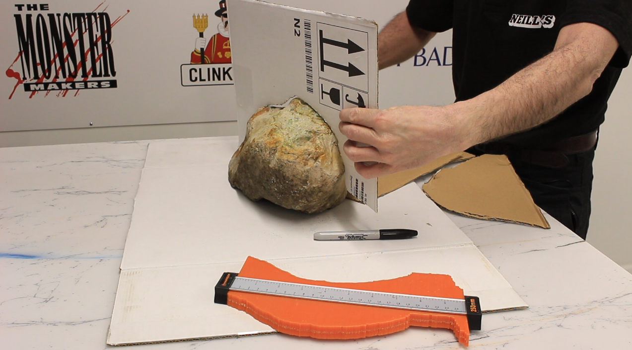 Measuring the profile of a rock using a profile gauge.