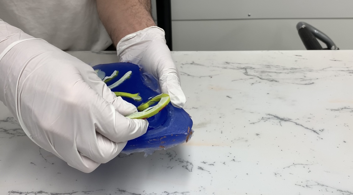 Removing the object from the silicone mould.